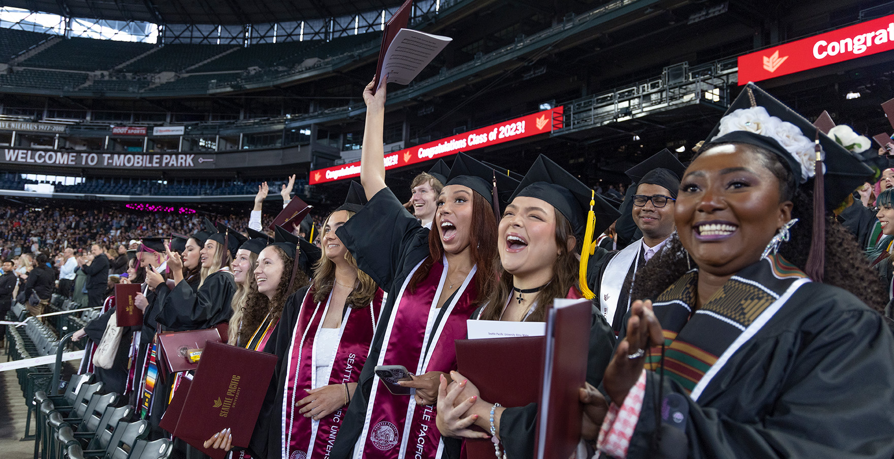 SPU graduates cheer at the Commencement ceremony at T-Mobile Park | photo by Mike Siegel