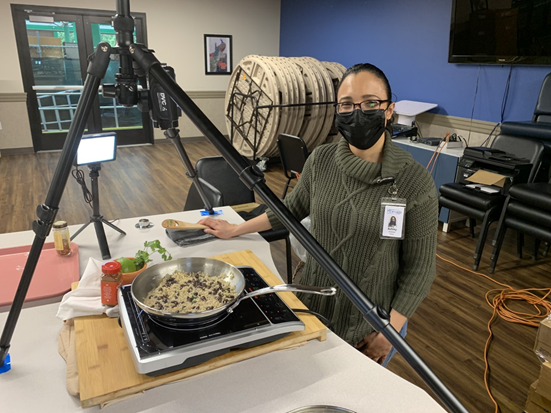 Pictured is Ashley recording a virtual cooking demonstration about instant brown rice recipes for clients served through Homage Senior Services.