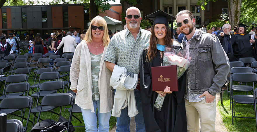 A family poses for a picture at SPU