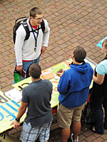A student talks to representatives at the SPU Church Fair