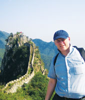 SPU Professor Douglas Downing stands at the Great Wall of China.