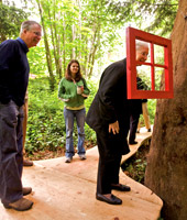 Roger Feldman (left) and guests look at the outdoor art.