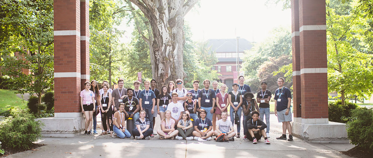 Immerse 2019 group shot under the arch at SPU